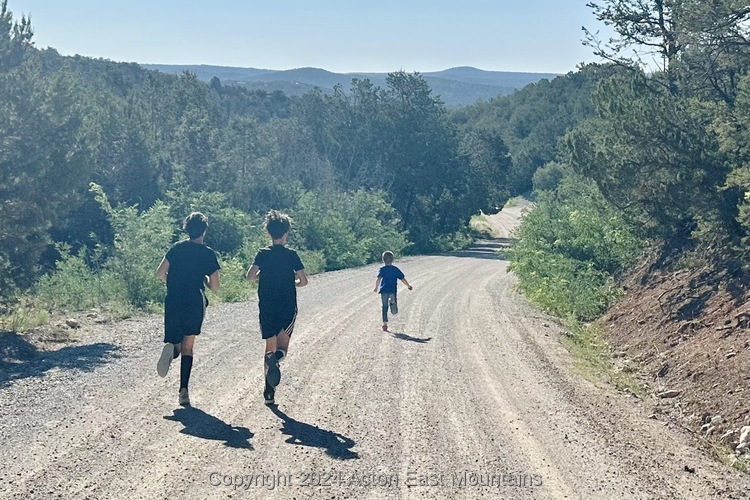 Learners at Acton Academy East Mountains private school in Cedar Crest, New Mexico playing outside