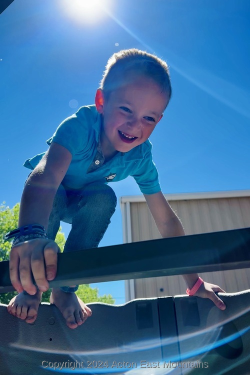 Learners at Acton Academy East Mountains private school in Cedar Crest, New Mexico playing outside