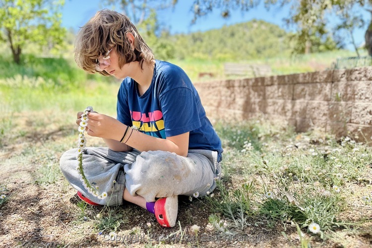 Learners at Acton Academy East Mountains private school in Cedar Crest, New Mexico playing outside