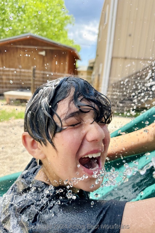 Learners at Acton Academy East Mountains private school in Cedar Crest, New Mexico playing outside