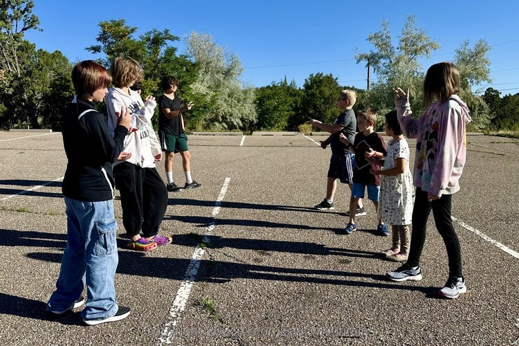 Learners at Acton Academy East Mountains private school in Cedar Crest, New Mexico playing outside.