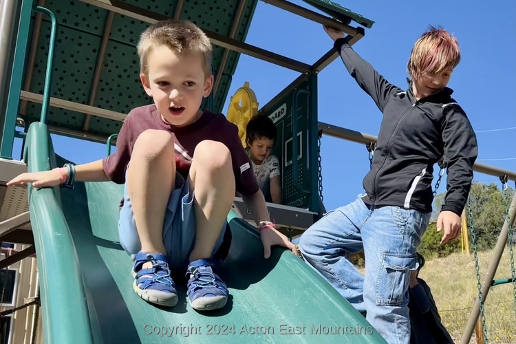 Learners at Acton Academy East Mountains private school in Cedar Crest, New Mexico playing outside.