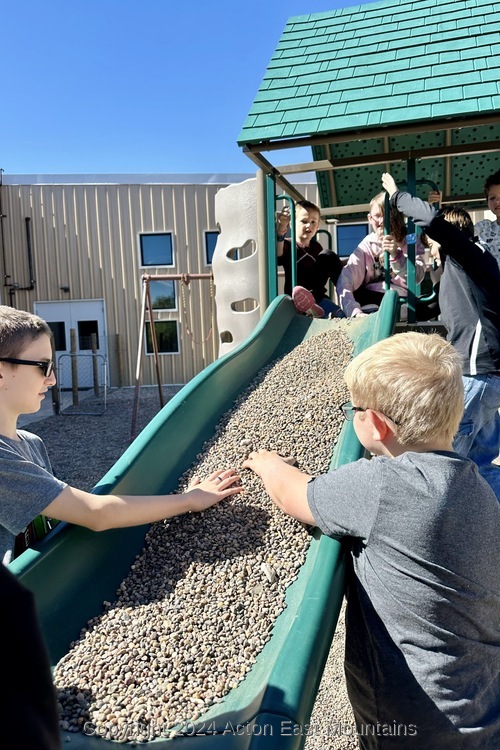 Learners at Acton Academy East Mountains private school in Cedar Crest, New Mexico playing outside.