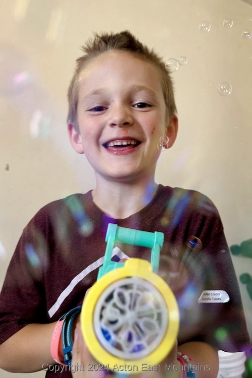 Learners at Acton Academy East Mountains private school in Cedar Crest, New Mexico playing with bubbles. 